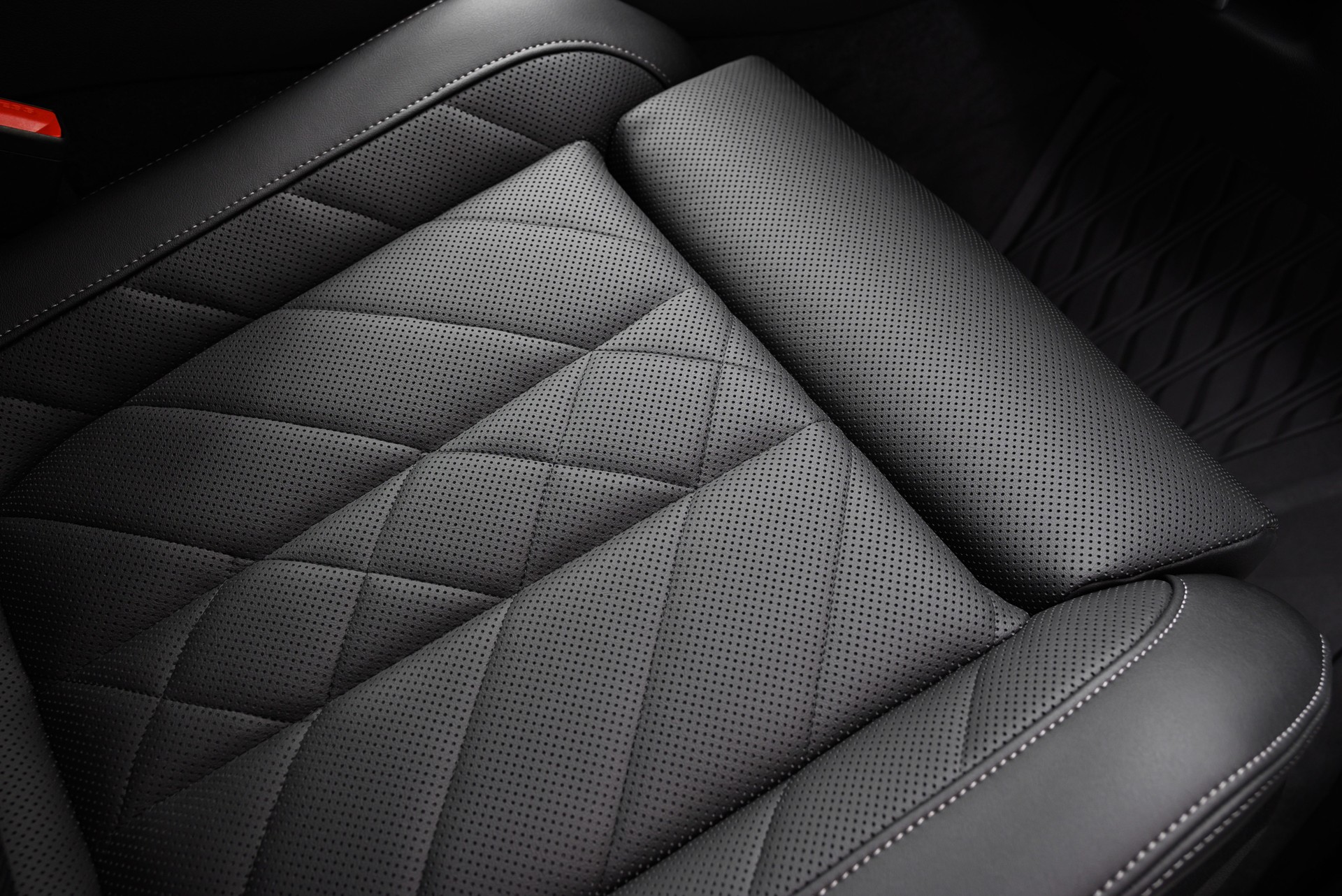 Black Perforated Leather Seat Surface with Stitching Details